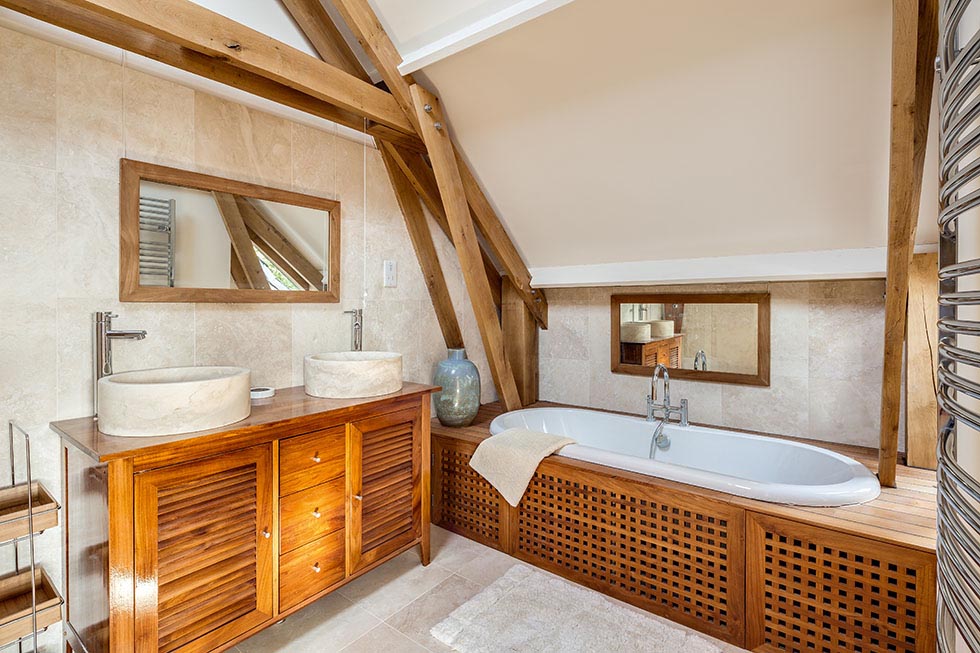 exposed frame in bathroom with vaulted ceiling