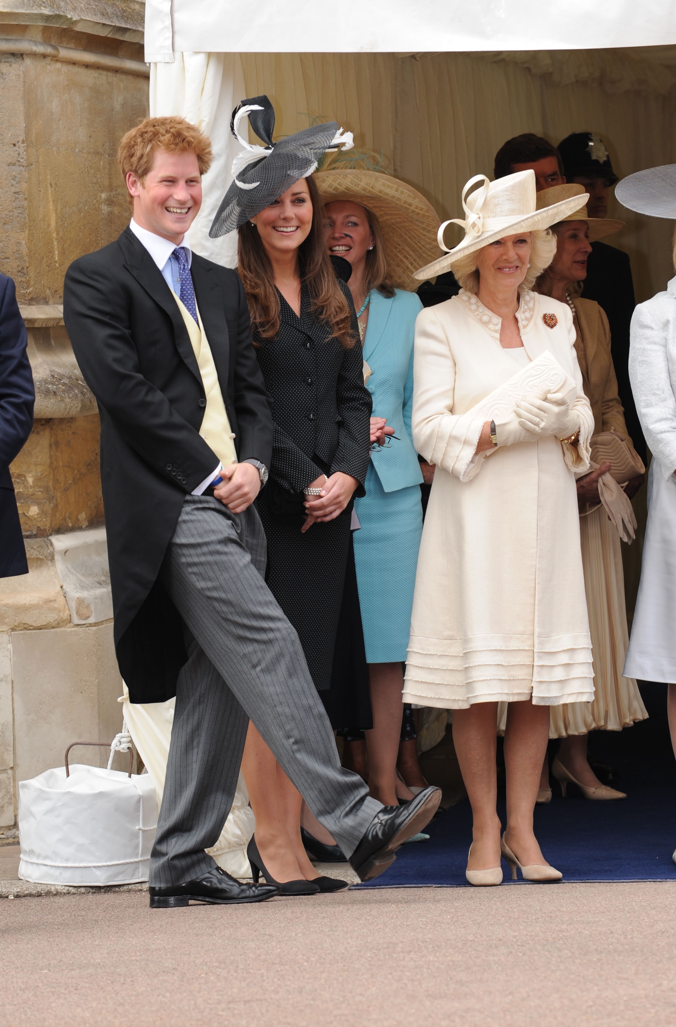 Princess Kate and Prince Harry laughing at Garter Day next to Queen Camilla