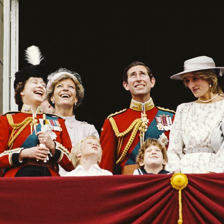 Princess Diana wears a white gown and matching hat on the Buckingham Palace balcony in 1983 for Trooping the Colour, alongside King Charles, Queen Elizabeth, Prince Philip, Princess Michael of Kent