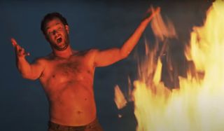 Cast Away Tom Hanks shouting in front of a bigger fire