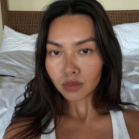 Creator @mimixn taking a selfie with a natural makeup look