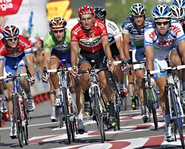 Vuelta leader Juan Jose Cobo (Geox-TMC) crosses the finish line in Noja and remains atop general classification with three stages remaining.
