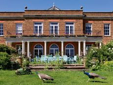 Fig 2: The south front of the house, outwardly a red-brick Georgian box of classic form. Fawley Hill, Buckinghamshire. ©Paul Highnam for Country Life