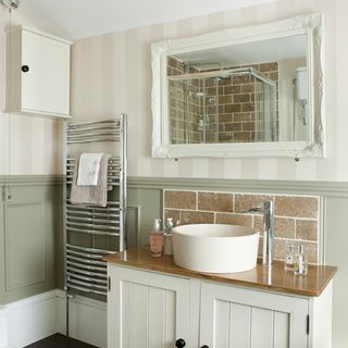bathroom with basin unit and waterfall tap