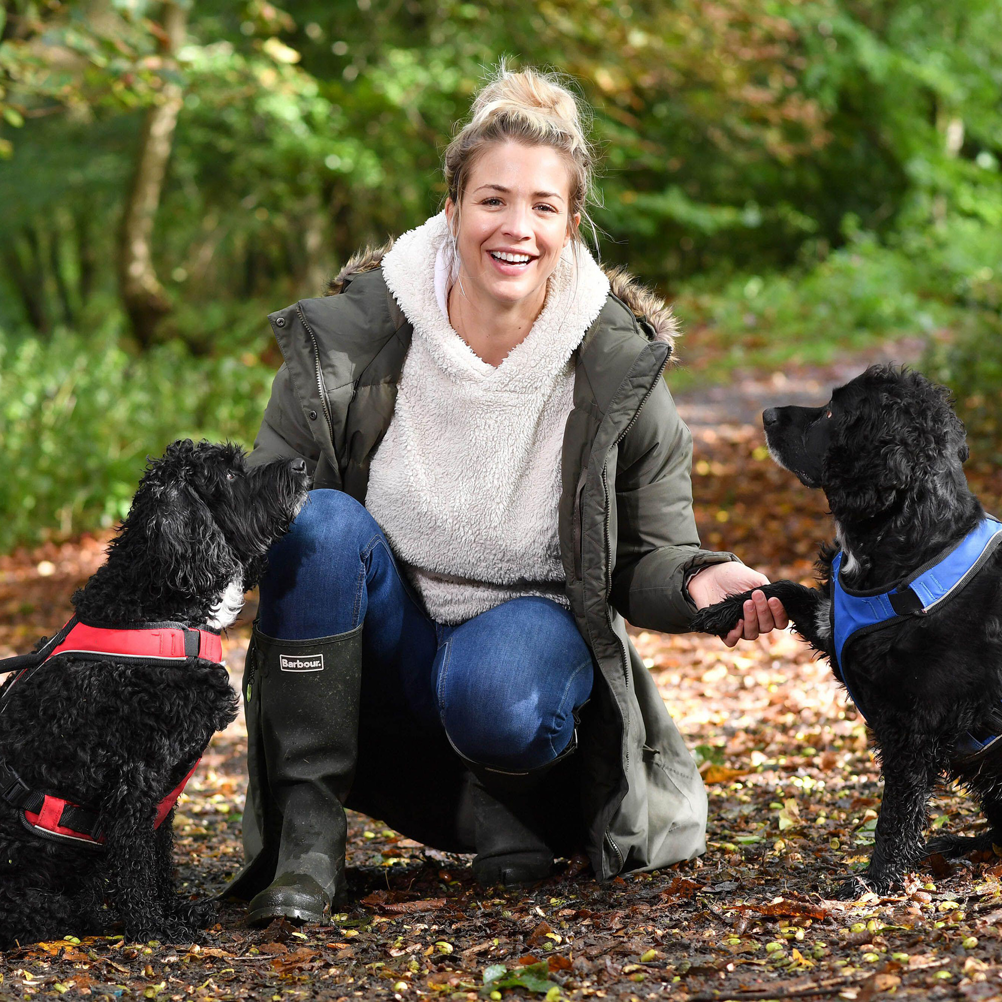 Gemma Atkinson walks dogs Sproodle Norman (left) and Cocker Spaniel Ollie in Old Kay's Park, Bury