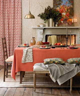 Country dining room ideas with orange tablecloth