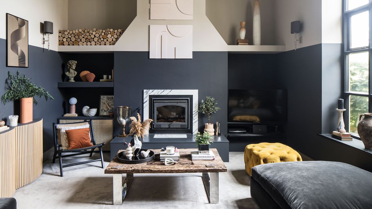 Energy-saving tech a neutral living room with navy blue painted walls armchairs and yellow footstool