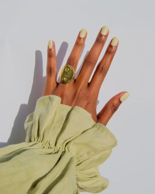 Photo of lime green nail polish on hand