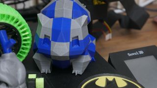 Close up of 3D printed dual-color Bulbasaur