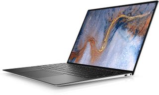 Dell XPS 13 OLED laptop in silver colorway on white background