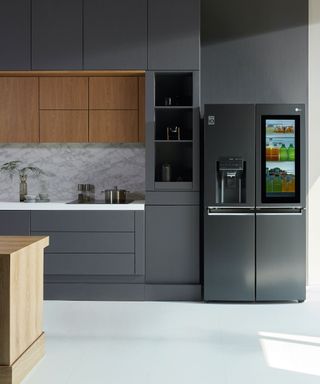 Modern kitchen with grey fridge freezer