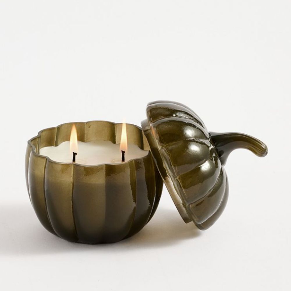 Green glass pumpkin shaped candle