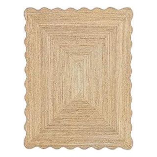 Scalloped rattan rug