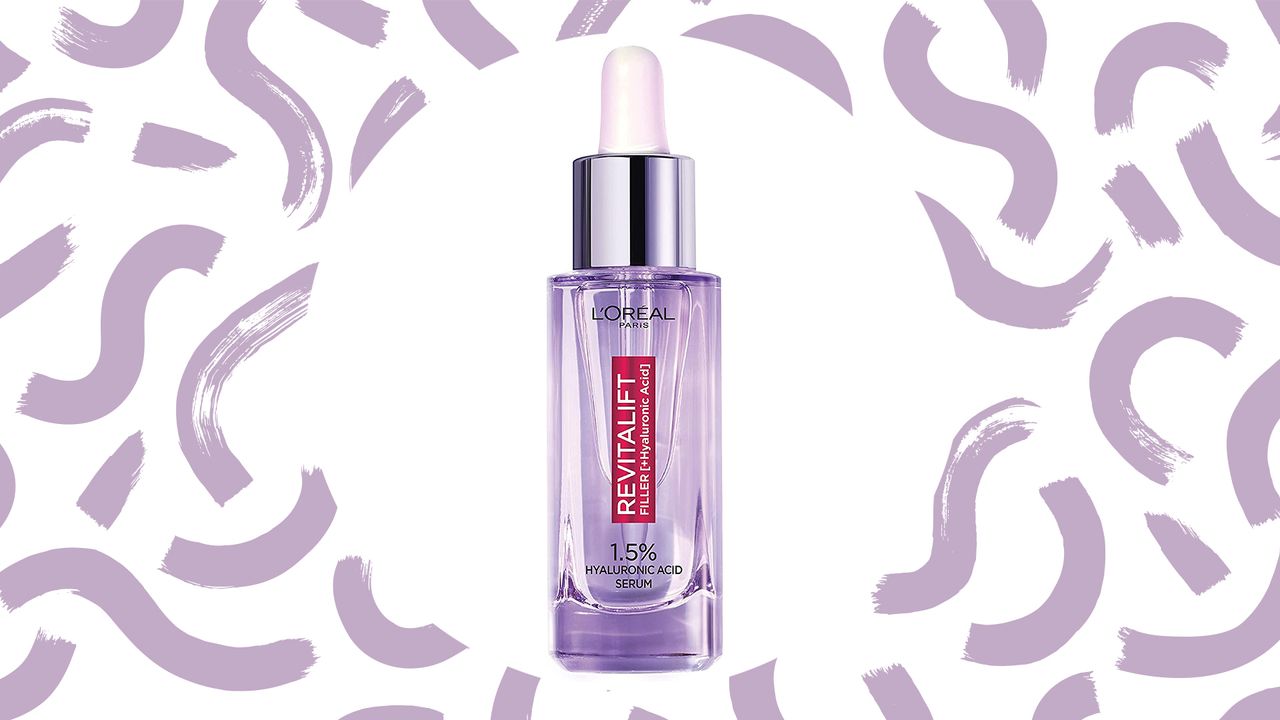 L&#039;Oréal hyaluronic acid serum Revitalift filler purple bottle on lilac swirl background