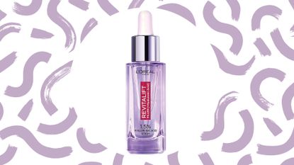 L'Oréal hyaluronic acid serum Revitalift filler purple bottle on lilac swirl background
