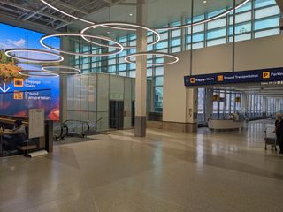 The lobby in MSP airport lit up with LG digital displays.