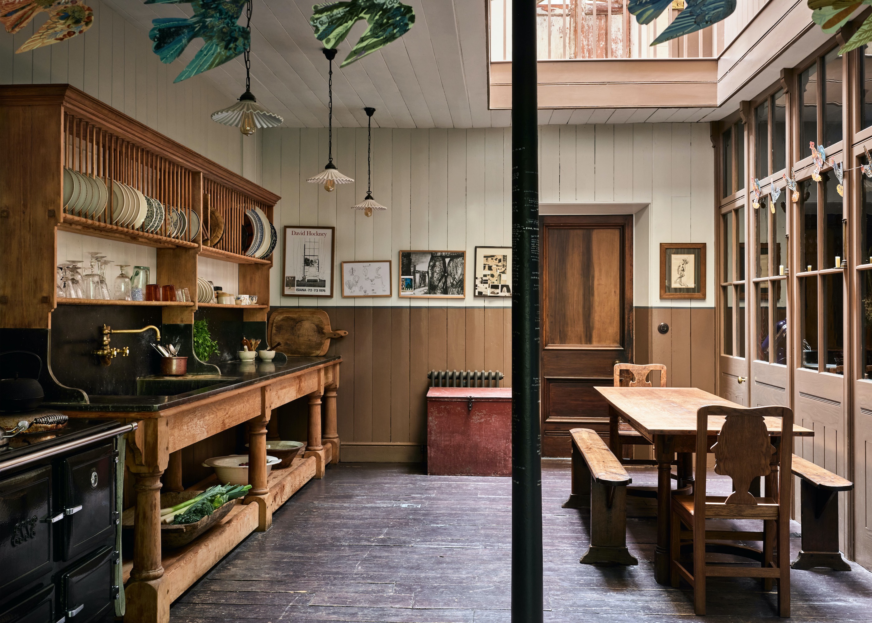 brown kitchen with large oak dresser and glazed divider