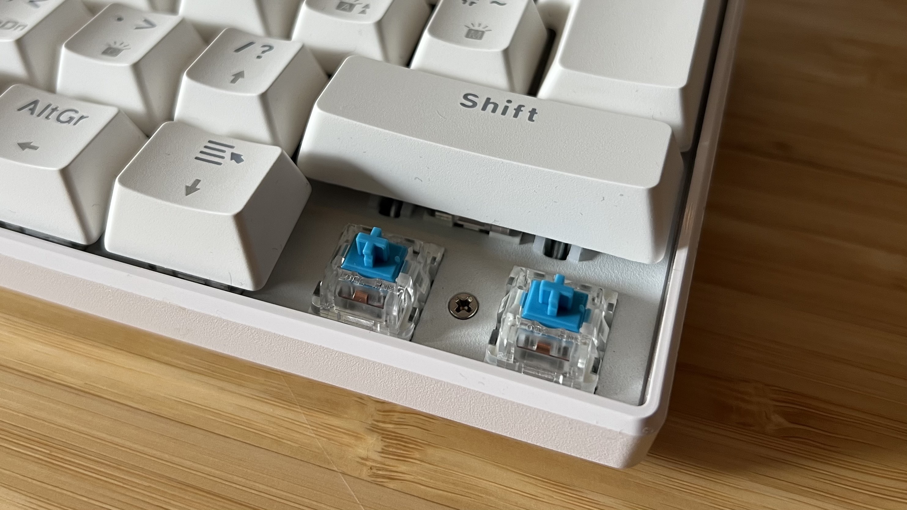 Acer Predator Aethon 330 with keycaps removed to reveal blue Kailh switches underneath