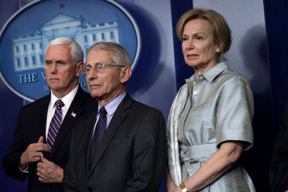 U.S. Vice President Mike Pence, Director of the National Institute of Allergy and Infectious Diseases Dr. Anthony Fauci, and White House Coronavirus Response Coordinator Deborah Birx listen d