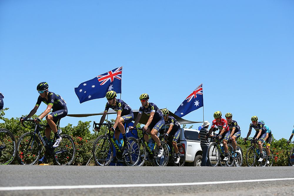 Australian flags fly as the peloton passes