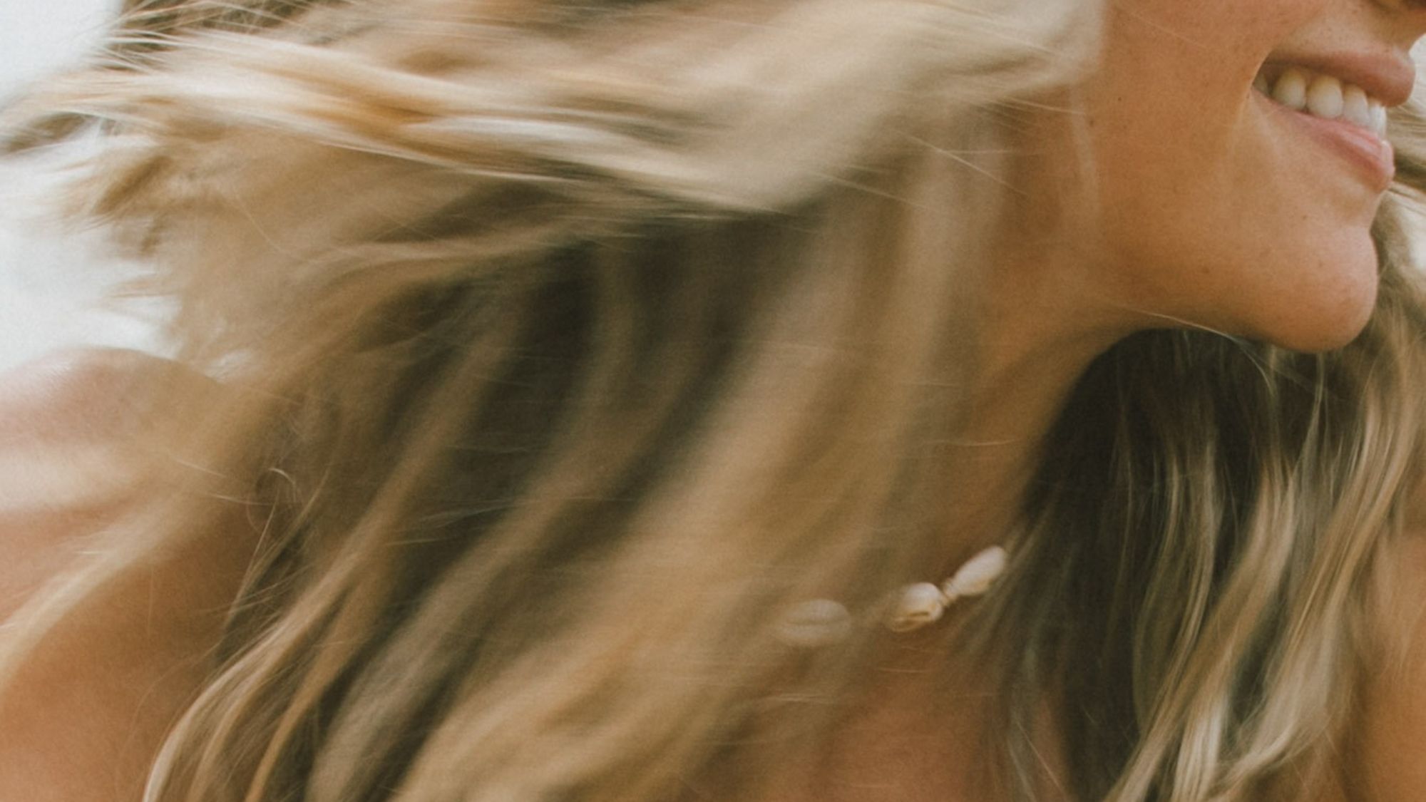 A close up shot of a woman smiling