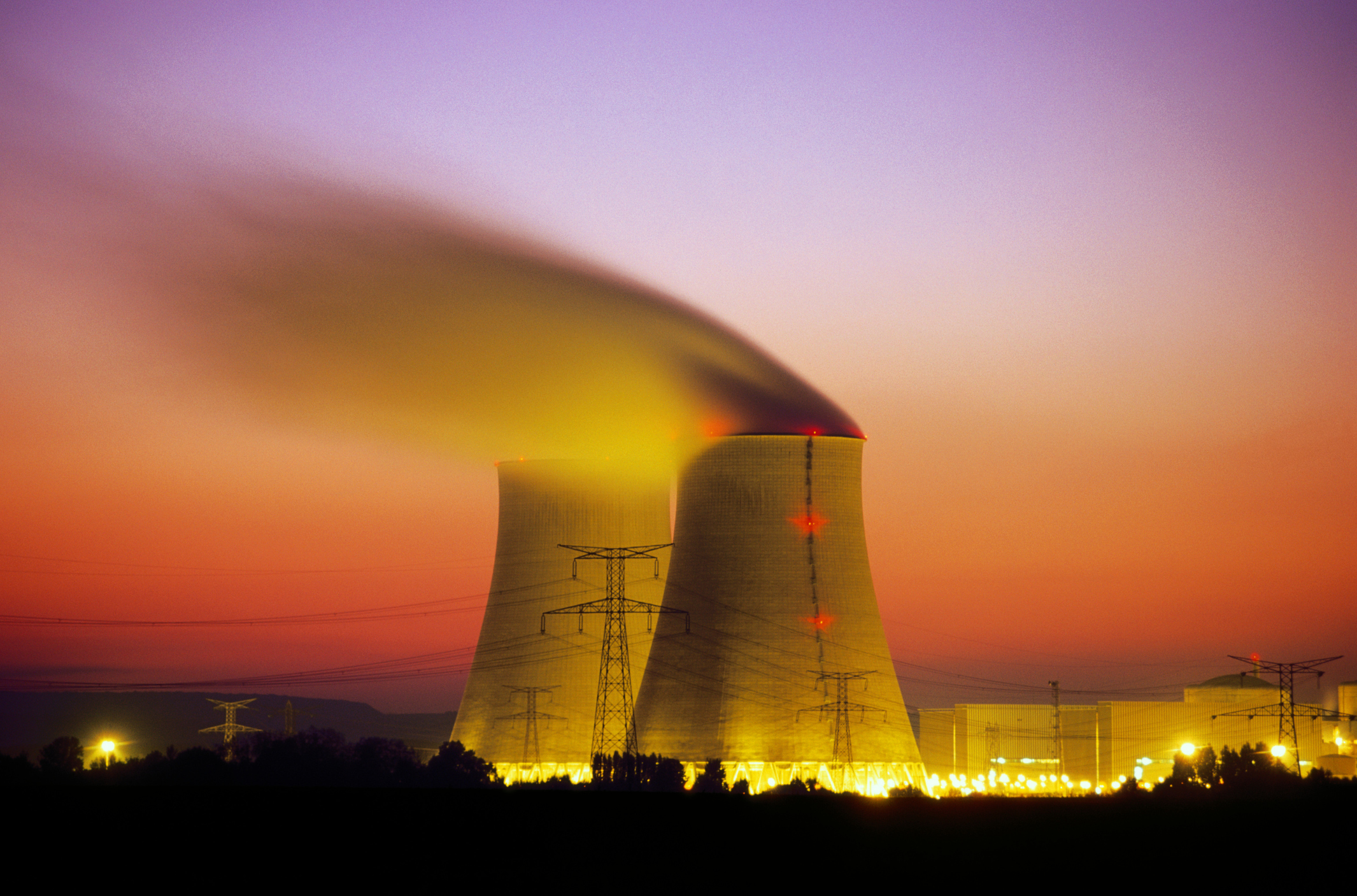 A nuclear cooling tower at sunset.