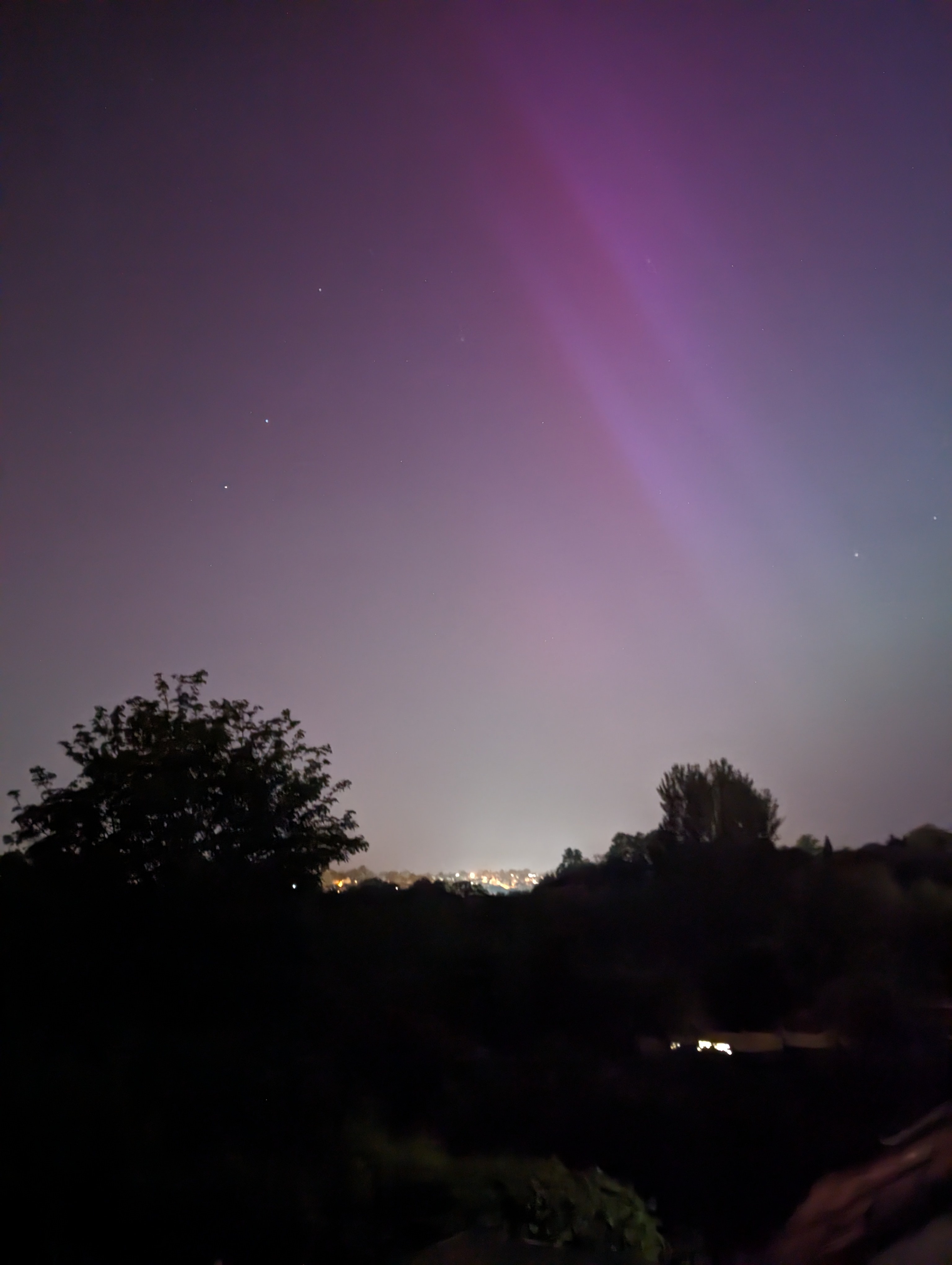 Faint purple and pink hues of the Northern lights captured in the UK.