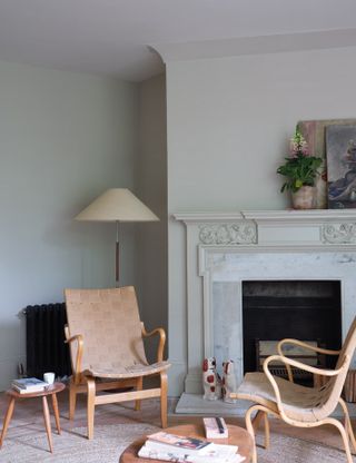 Pale green/grey living room with rattan chairs