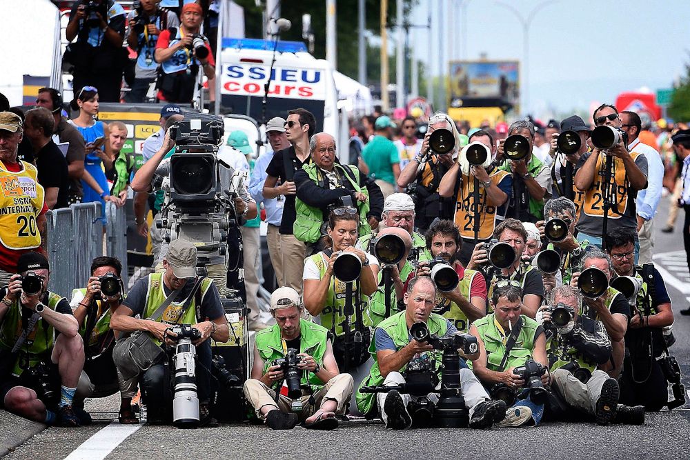 Photograohers wait for the sprint finish.