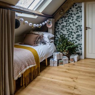 Cabin bed in eaves with Christmas tree