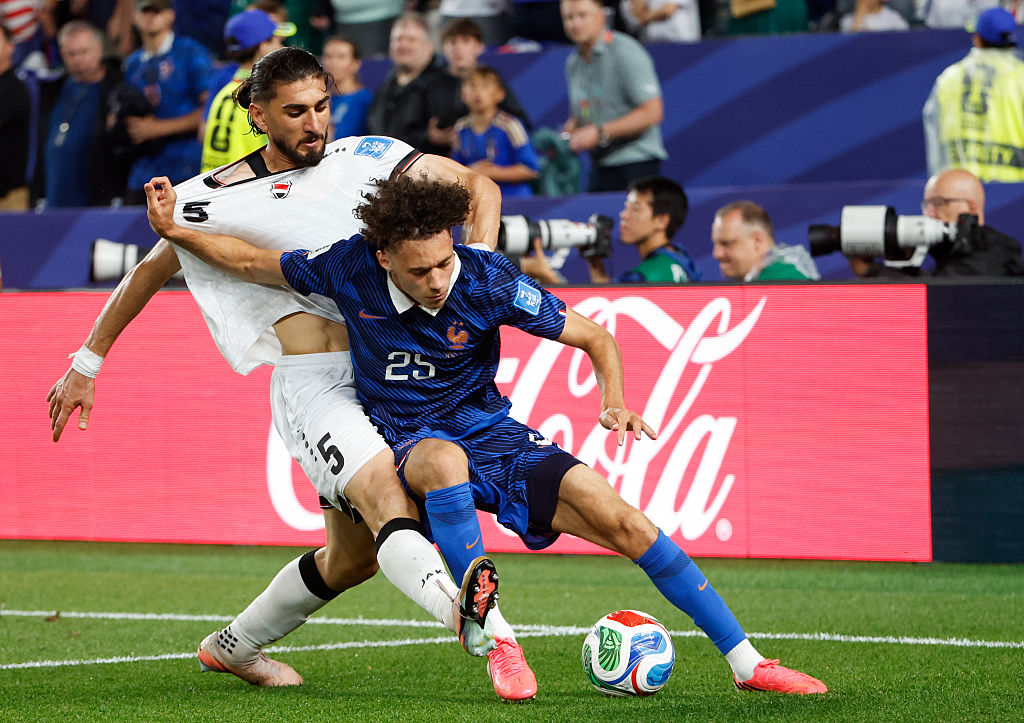 PHILADELPHIA, PENNSYLVANIA - JUNE 22: Maghnes Akliouche #25 of France, left Akam Hashim #5 of Iraq during the FIFA World Cup 2026 Group I football match between France and Iraq at Philadelphia Stadium on June 22, 2026 in Philadelphia, PA, United States. (Photo by Jean Catuffe/Getty Images)