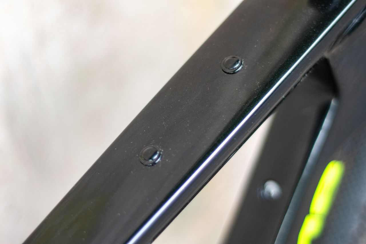 An Argon 18 Anti Matter gravel bike leaning against a concrete wall.