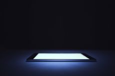 smart phone lit up in the dark