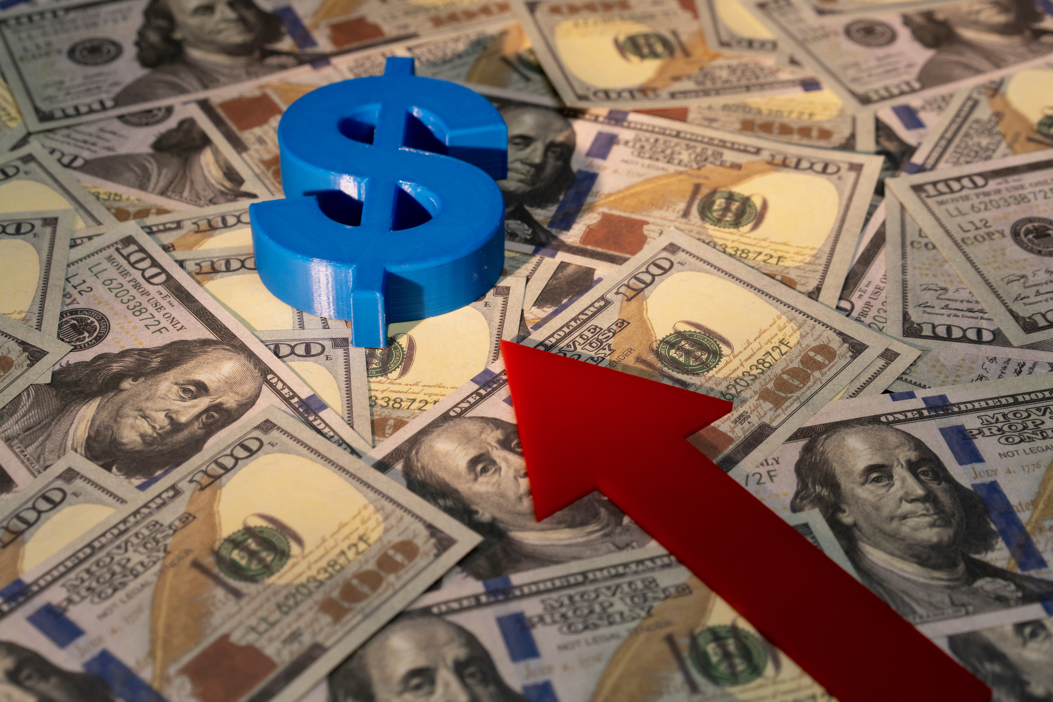 Economic graph with up arrow, dollar bill