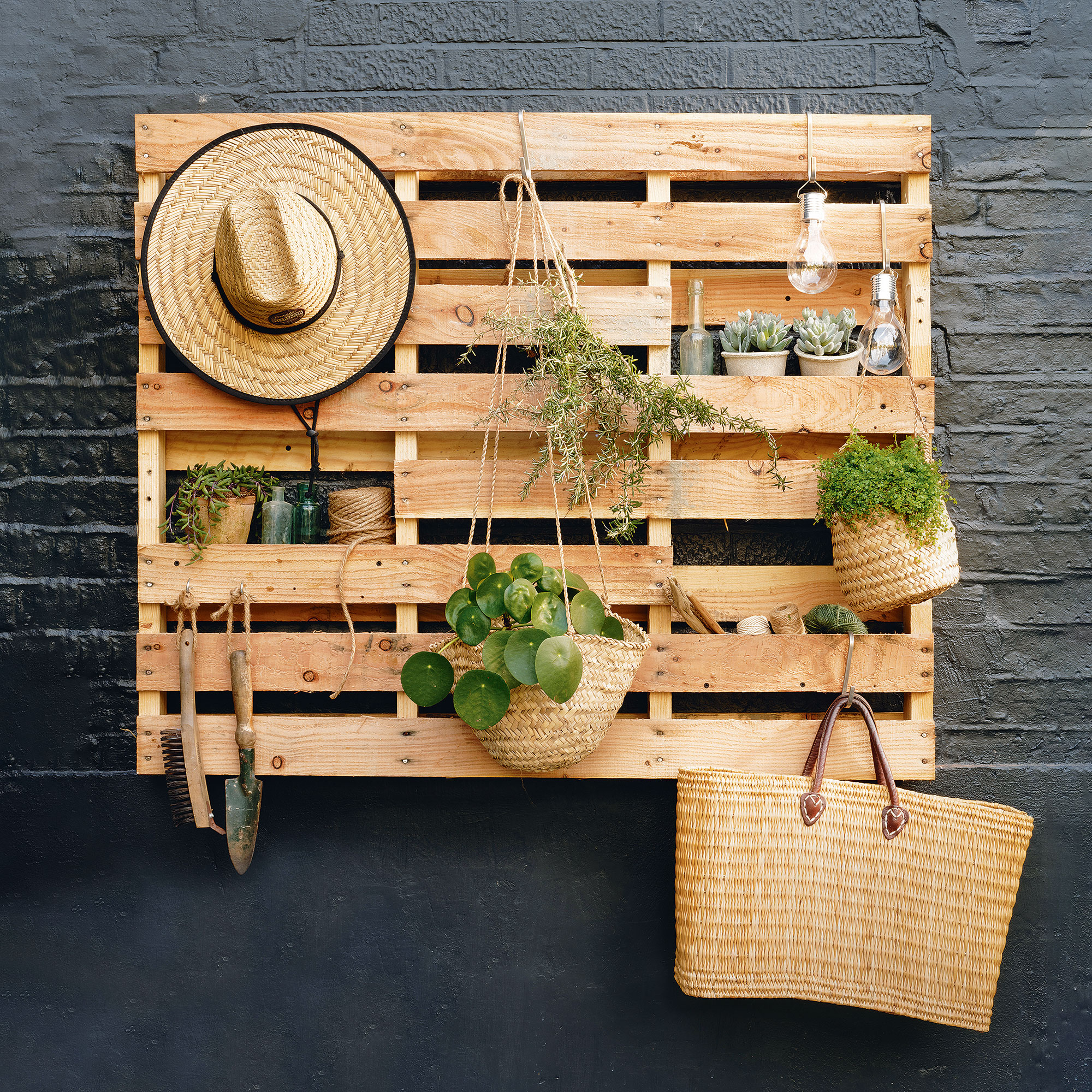 Garden wooden pallet storage on wall