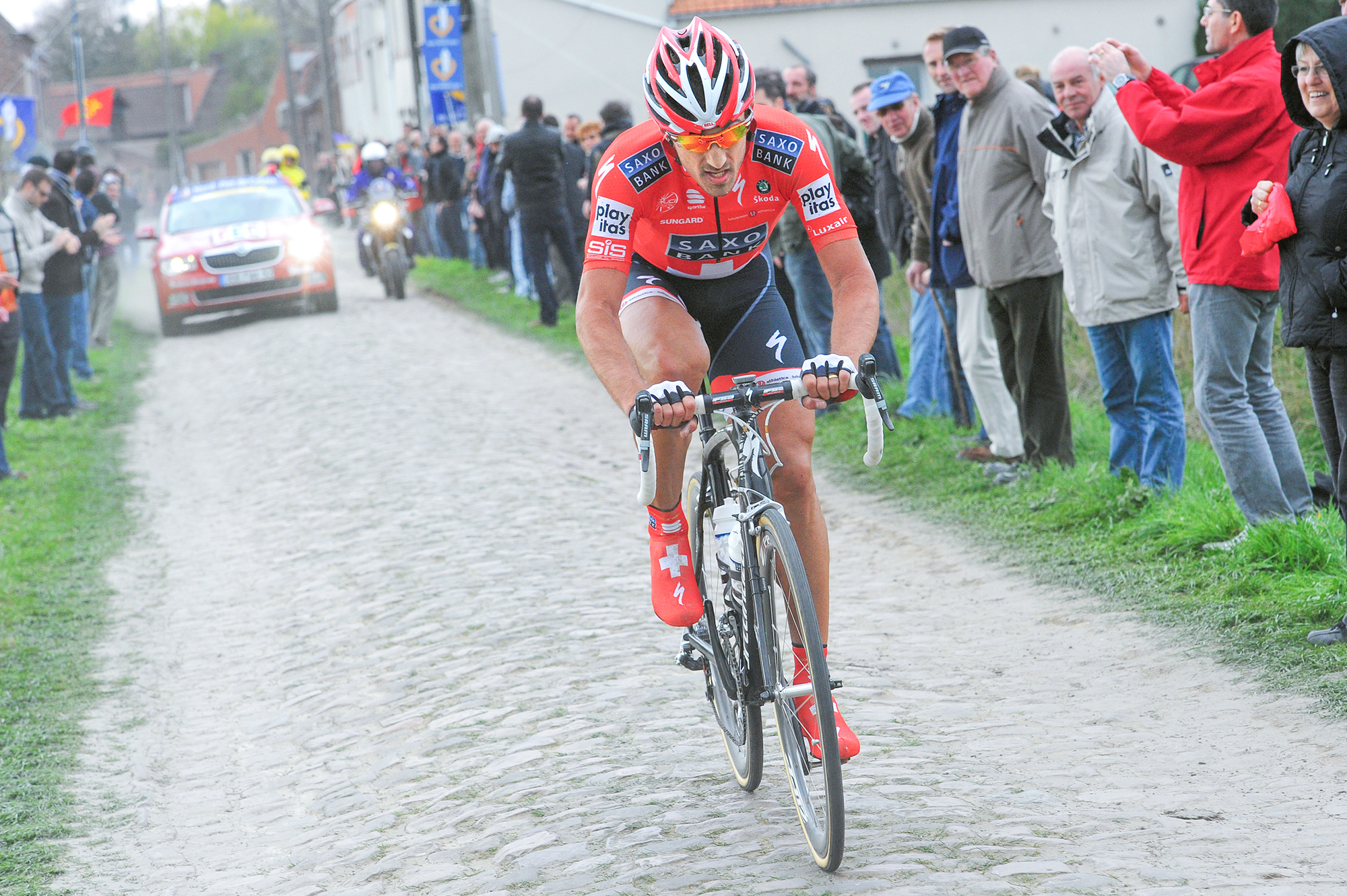 Swiss champion Fabian Cancellara races solo over a cobbled sector at the 2010 Paris-Roubaix
