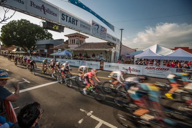 The field streaks past start/finish.