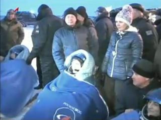 Expedition 33 crew seated after Soyuz landing.