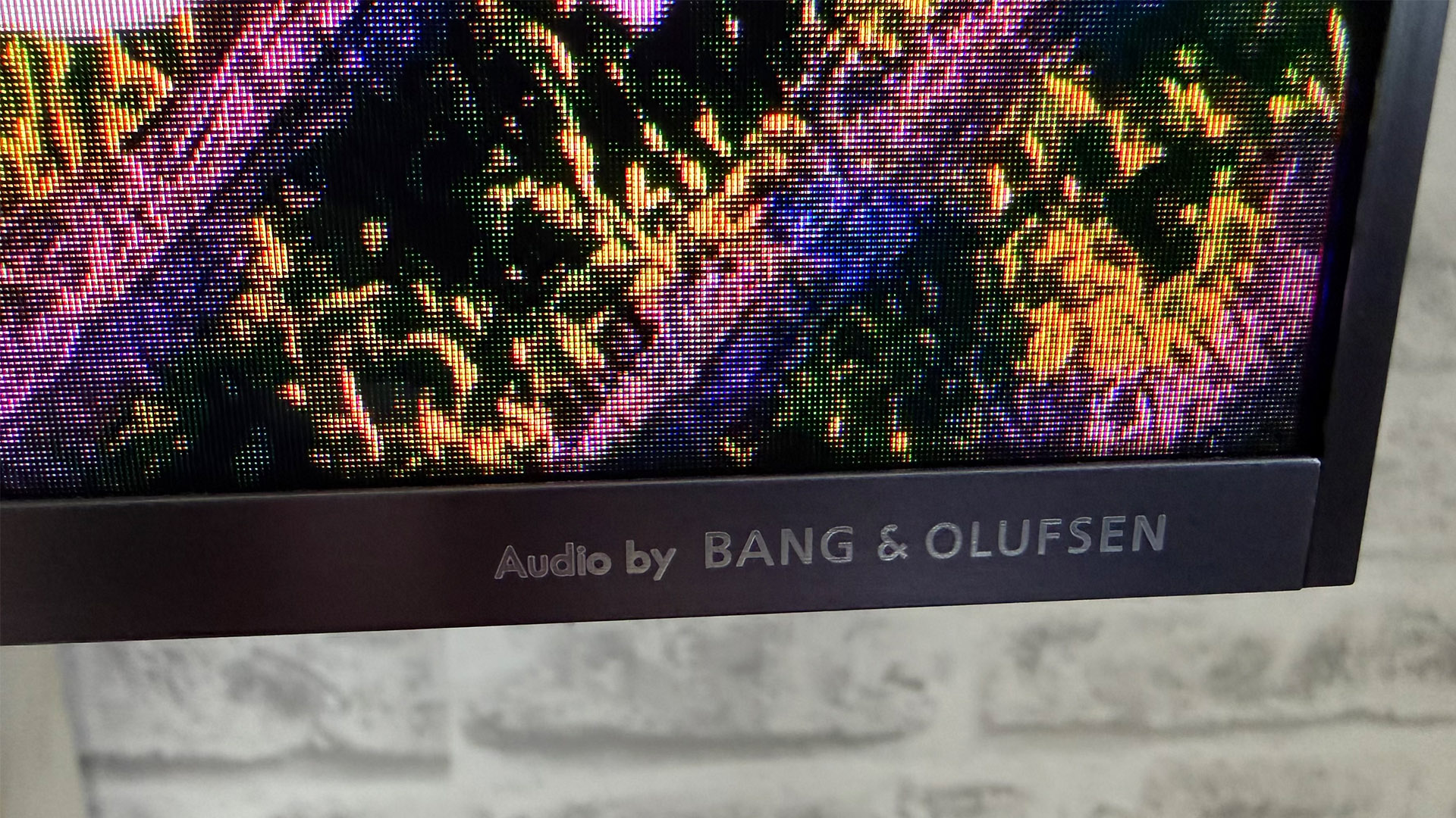 TCL C8L Mini LED TV bottom right corner of set with 'Audio by Bang &amp;amp; Olufsen' logo