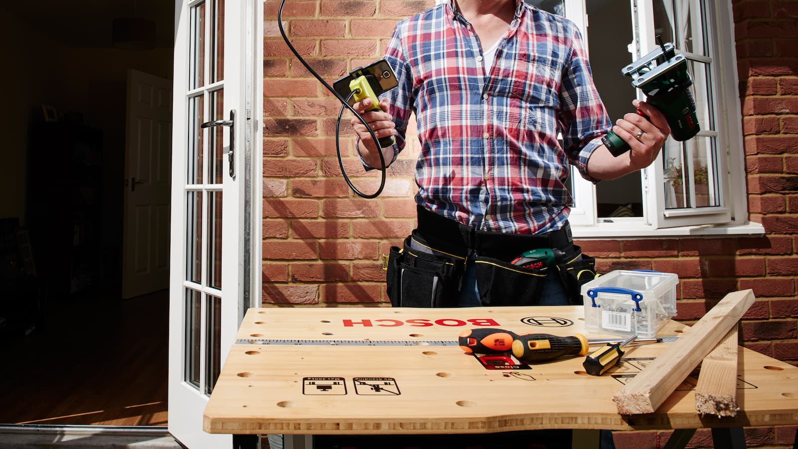 A cowboy builder using DIY tools