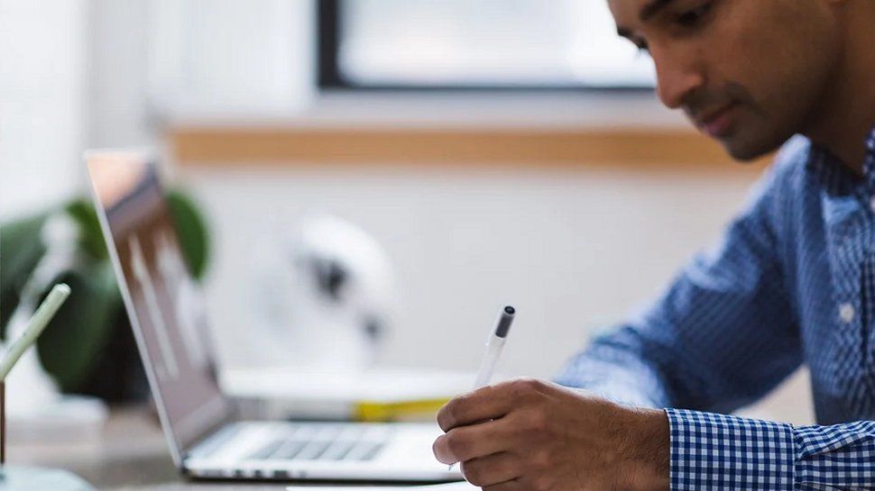 A person working at a laptop.