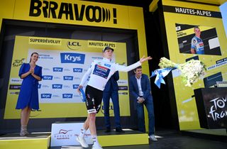 SUPERDEVOLUY LE DEVOLUY FRANCE JULY 17 Remco Evenepoel of Belgium and Team Soudal QuickStep White Best Young Rider Jersey celebrates at podium during the 111th Tour de France 2024 Stage 17 a 1778km stage from SaintPaulTroisChateaux to Superdevoluy 1500m UCIWT on July 17 2024 in Superdevoluy Le Devoluy France Photo by Dario BelingheriGetty Images