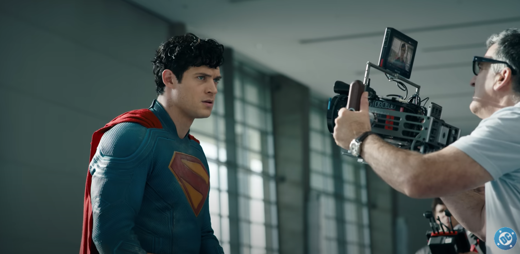 A man in a superhero costume on a movie set