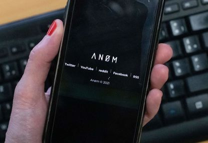 Smartphone showing Anom app.