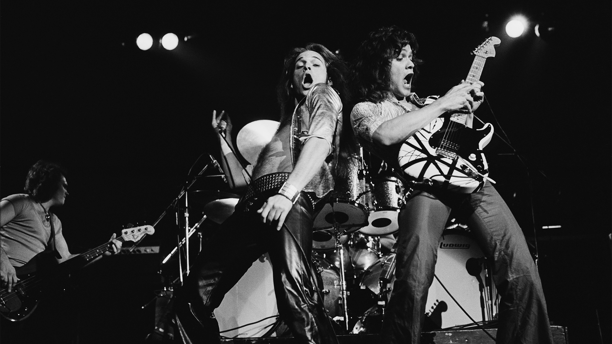 Van Halen perform live on stage at Lewisham Odeon in London on 27th May 1978. Left to Right: Michael Anthony, David Lee Roth, Eddie Van Halen.