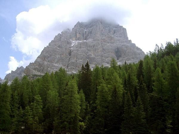 A massive piece of pink rock (coral!) overlooks the Passo Staulanza
