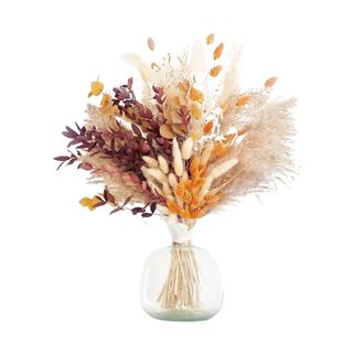 A bunch of fall dried flowers in a vase