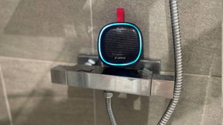 Lenrue F9 Bluetooth speaker on top of a shower unit