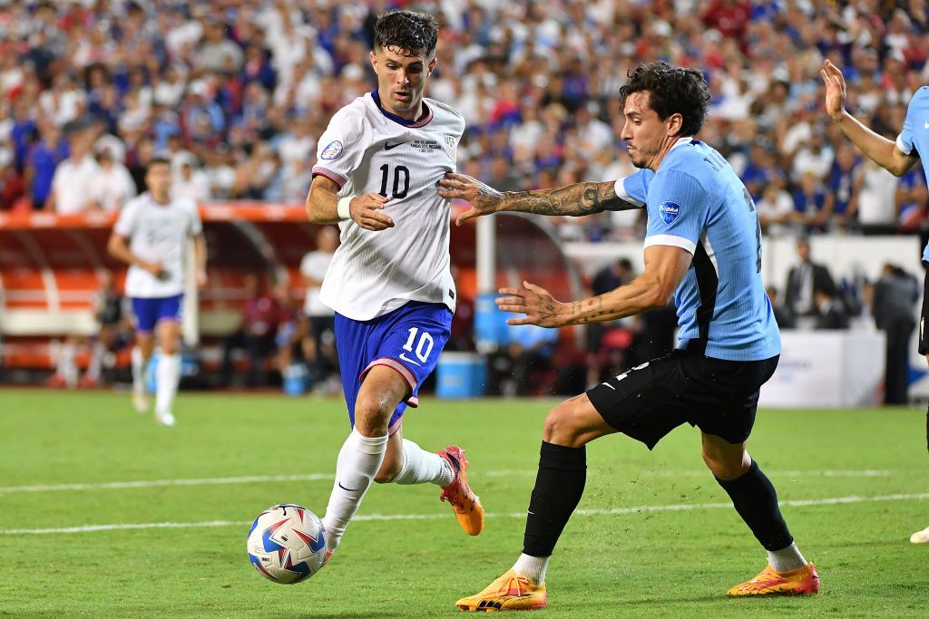 Christian Pulisic #10 of the United States is defended by Jose María Gimenez #2 of Uruguay during the second half at GEHA Field at Arrowhead Stadium on July 01, 2024 