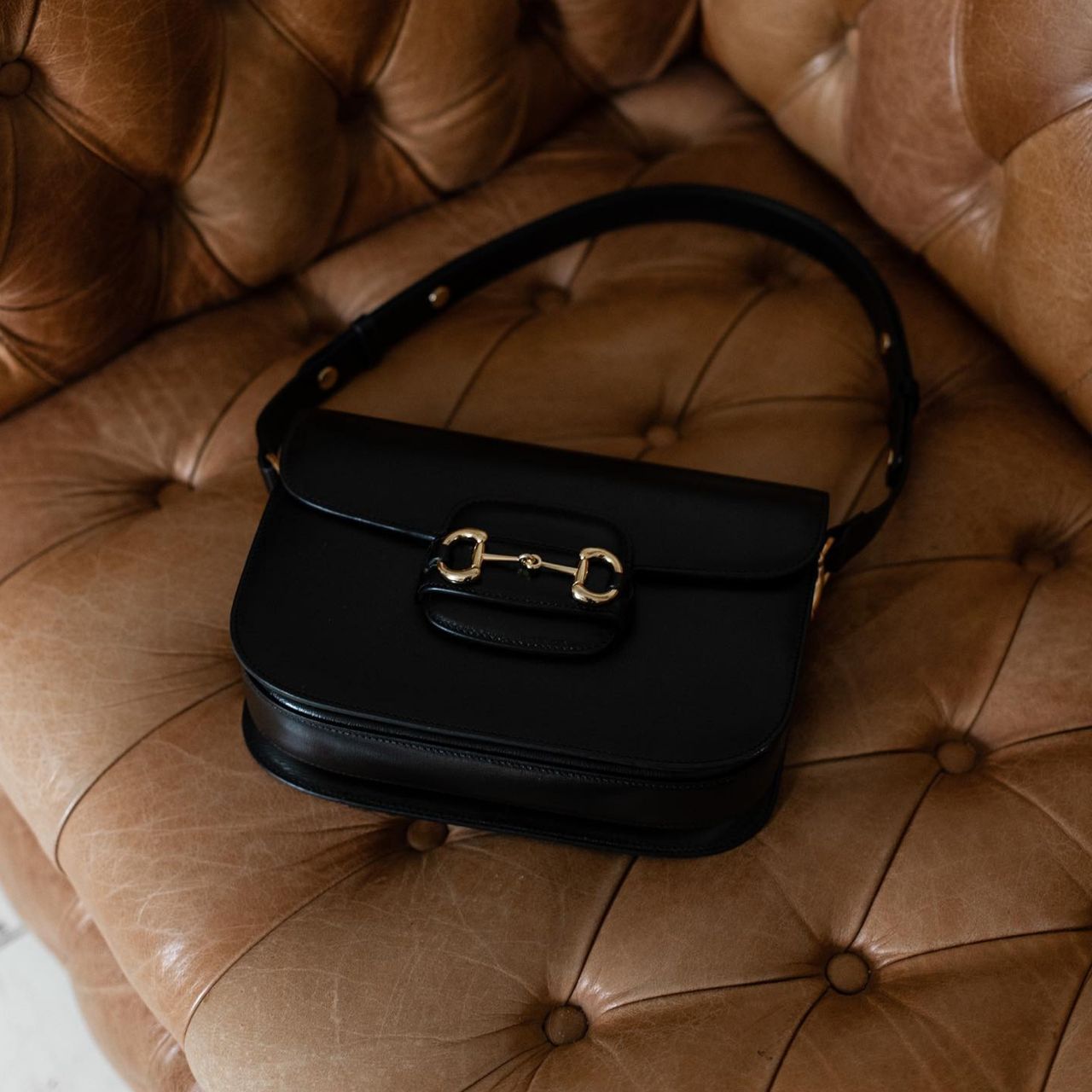 An image of a black Gucci handbag.